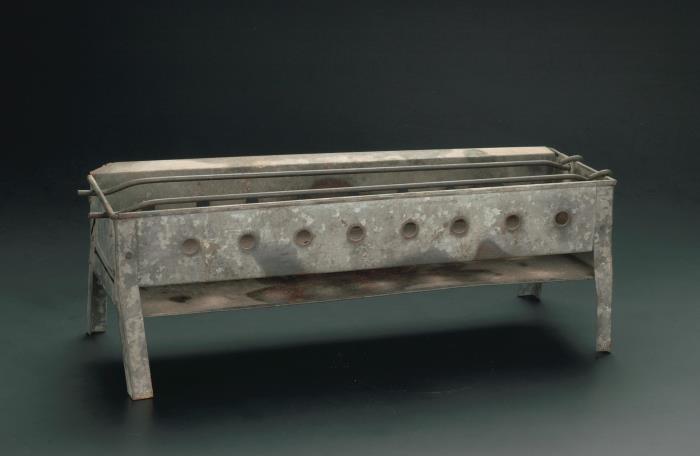 <a href="https://www.roots.gov.sg/Collection-Landing/listing/1072204"><strong>Metal stove for grilling satay</strong></a><br>
1994-04278<br>
20th century<br>
Collection of National Museum of Singapore, National Heritage Board